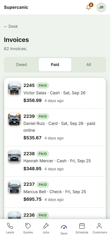 The invoices screen filtered to paid, with cash, card and check payments