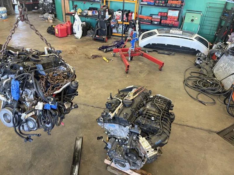 Two engines out on the floor of the Supercanic shop in San Jacinto